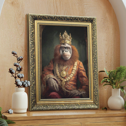 Framed portrait of a orangutan wearing a crown and king attire on a wooden surface.
