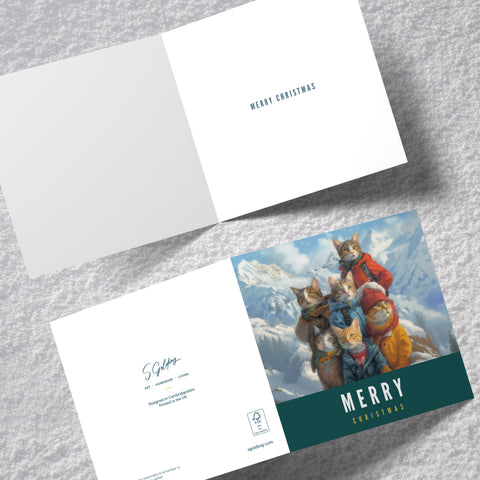 S.Golding Christmas Card | Cat Christmas Card | Cats dressed in coats on snowy mountain | Inside message: Merry Christmas | Cat Xmas