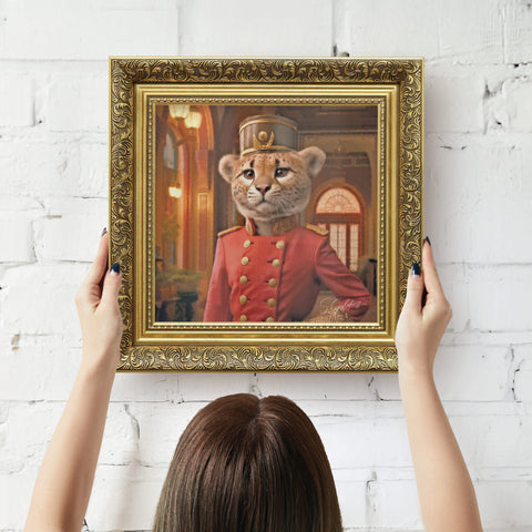Gold framed artwork of a Cheetah in regal attire being hung on wall by a person