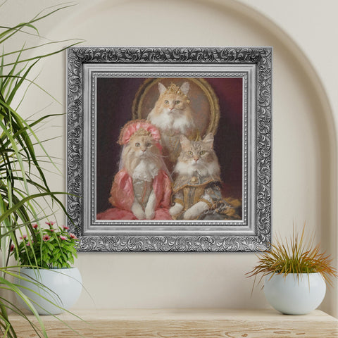 Regal cat family portrait wall art featuring three aristocratic cats in vintage clothing with ornate gold frame on a cream wall