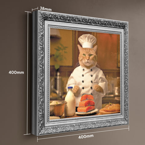 Framed artwork of a cat in a chef's outfit in a silver baroque frame with dimensions displayed.