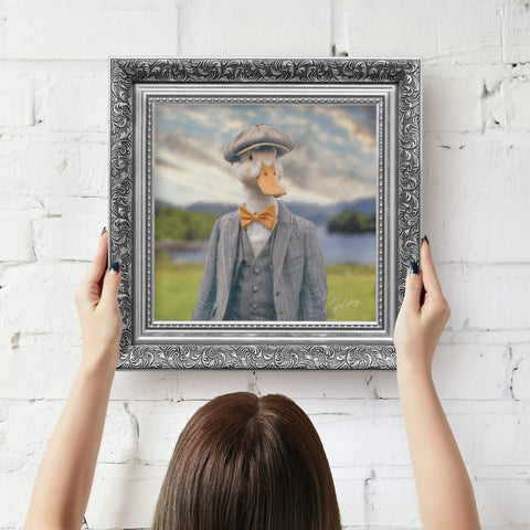 Duck framed artwork displayed in a silver baroque frame, artwork with S.Golding signature