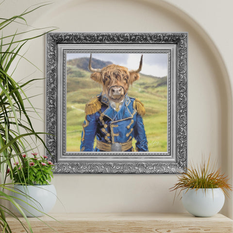 Highland cow framed wall art featuring a Scottish Highland cow in blue matador uniform with ornate silver frame, luxury animal decor for UK homes